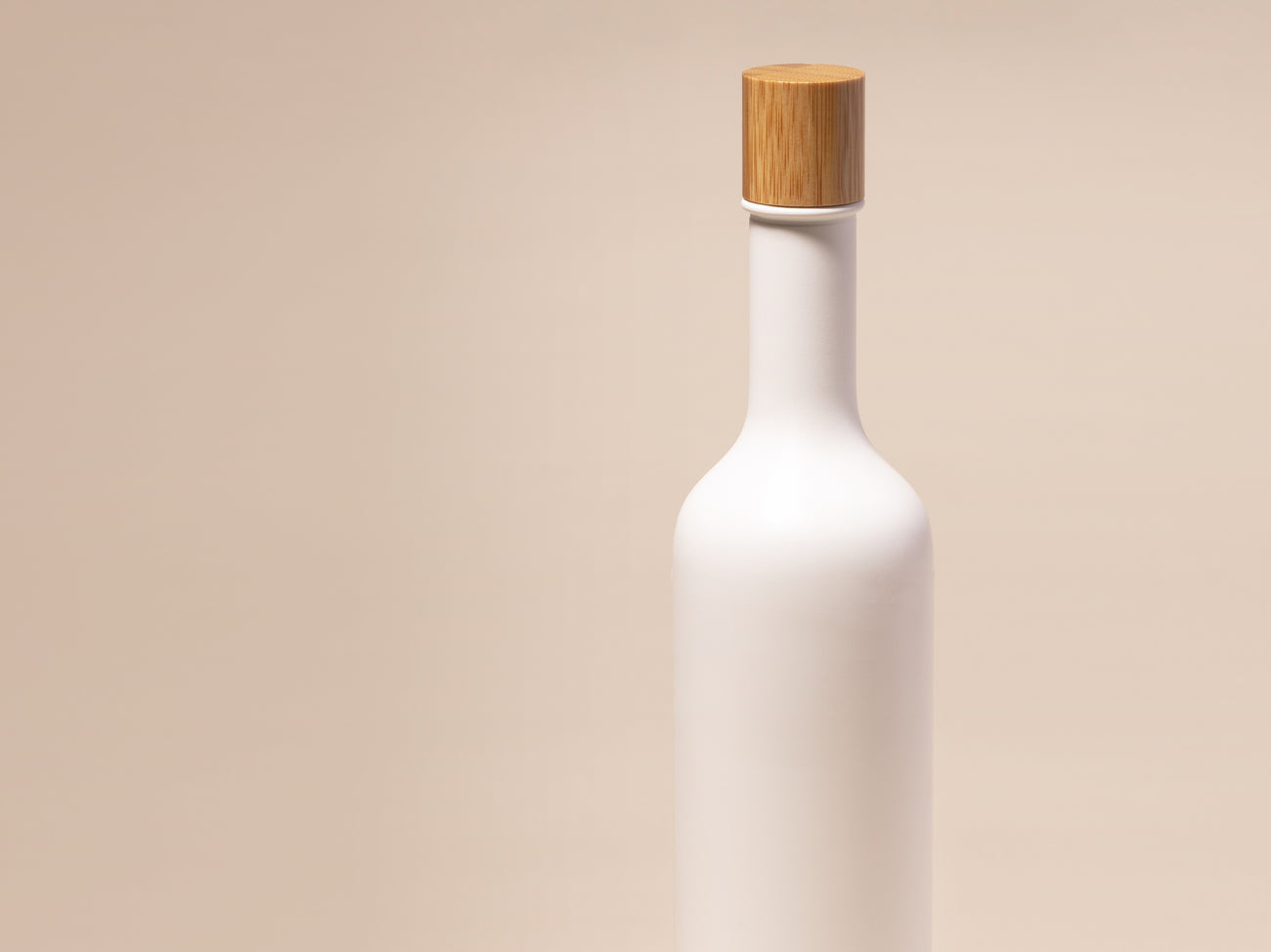 100% PCR white bottle with a bamboo cap